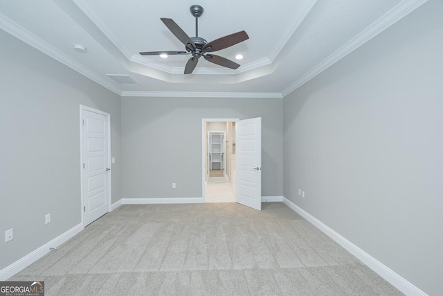 245 Ryan Nicholas Dr, Kingsland, GA 31548 - unfurnished bedroom featuring ornamental molding, baseboards, light colored carpet, recessed lighting, and a raised ceiling