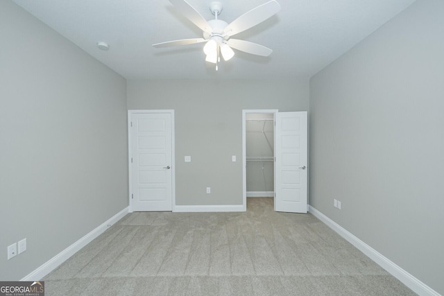 245 Ryan Nicholas Dr, Kingsland, GA 31548 - unfurnished bedroom with carpet flooring, baseboards, a walk in closet, and a closet