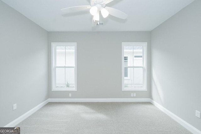 245 Ryan Nicholas Dr, Kingsland, GA 31548 - carpeted spare room with a ceiling fan, baseboards, and a wealth of natural light