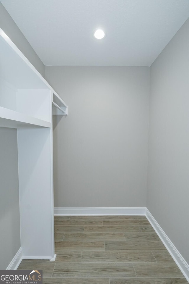 245 Ryan Nicholas Dr, Kingsland, GA 31548 - spacious closet featuring wood finished floors