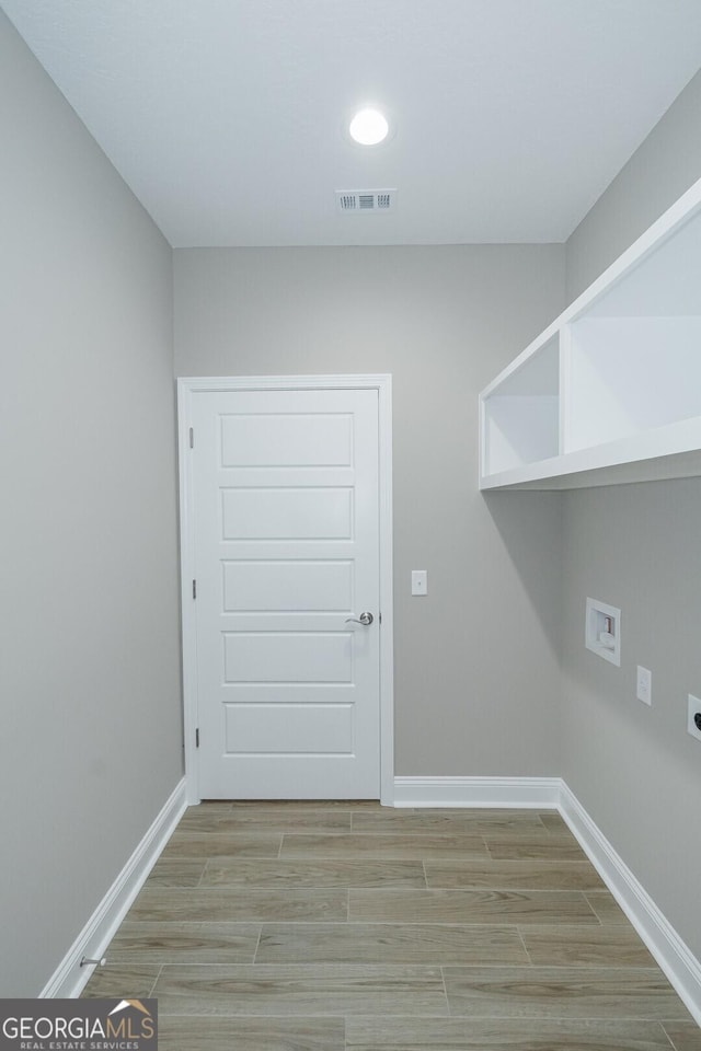245 Ryan Nicholas Dr, Kingsland, GA 31548 - laundry area with washer hookup, hookup for an electric dryer, laundry area, visible vents, and baseboards
