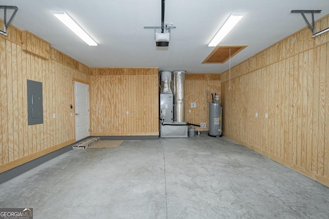 245 Ryan Nicholas Dr, Kingsland, GA 31548 - garage with a garage door opener, water heater, electric panel, and wood walls