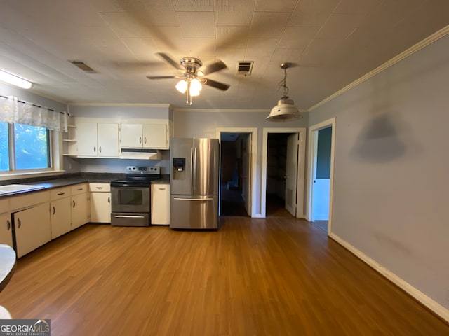 kitchen featuring ceiling fan, ornamental molding, white cabinetry, light hardwood / wood-style flooring, and appliances with stainless steel finishes