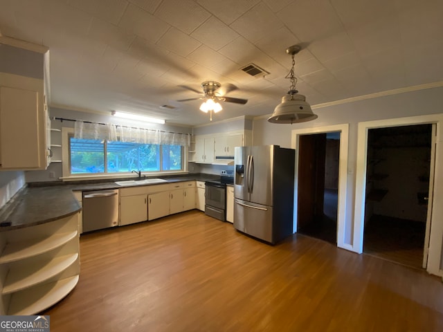 kitchen featuring crown molding, light hardwood / wood-style flooring, sink, white cabinets, and appliances with stainless steel finishes