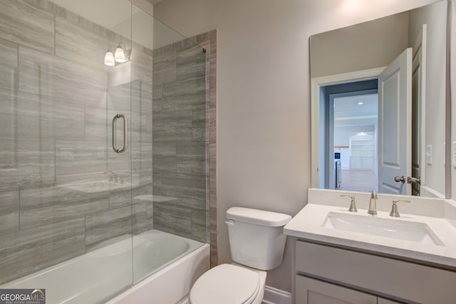 full bathroom featuring vanity, toilet, and enclosed tub / shower combo