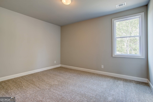 view of carpeted spare room