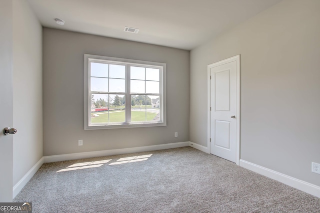 view of carpeted spare room