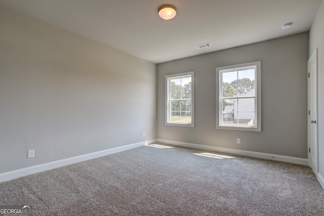 empty room featuring carpet floors