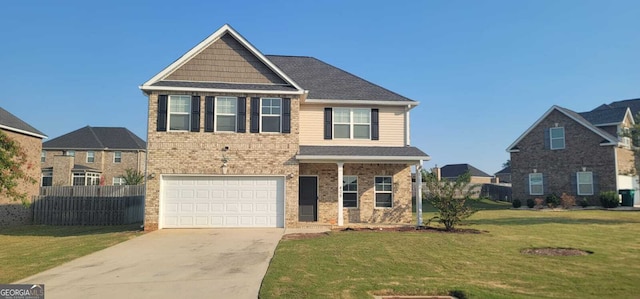 view of front of house featuring a front yard, fence, concrete driveway, a garage, and brick siding