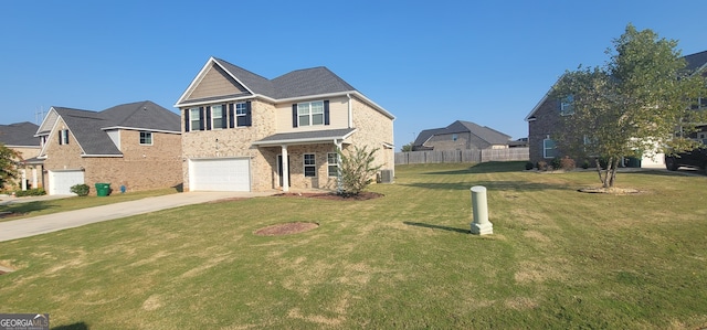 view of front facade featuring a front yard and a garage