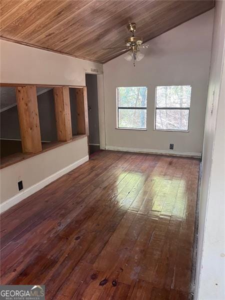 unfurnished living room with ceiling fan, vaulted ceiling, wood ceiling, and dark hardwood / wood-style flooring