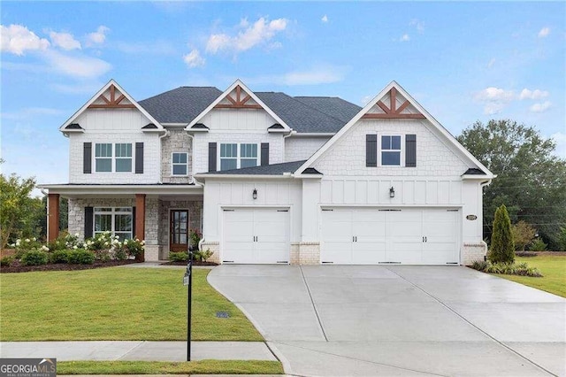 craftsman house with a front lawn and a garage