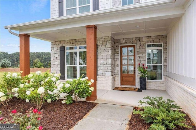 doorway to property with a porch