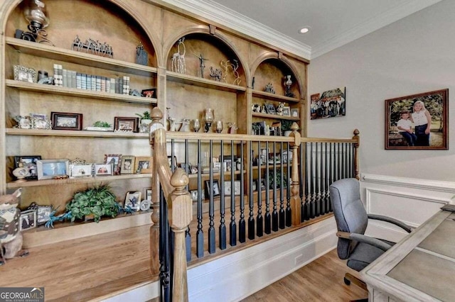 home office with hardwood / wood-style flooring and ornamental molding