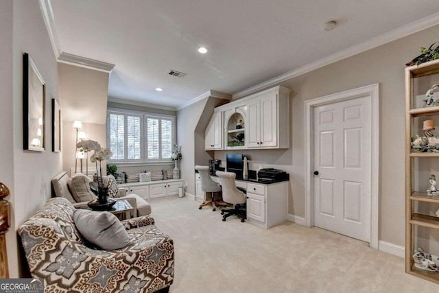 carpeted office with crown molding and built in desk