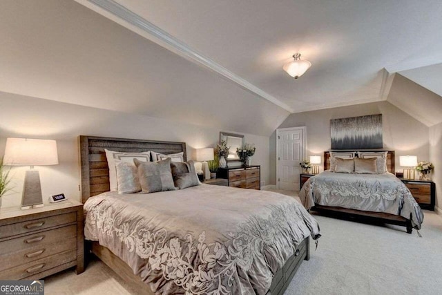 bedroom featuring light carpet and vaulted ceiling