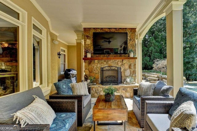 view of patio featuring an outdoor living space with a fireplace