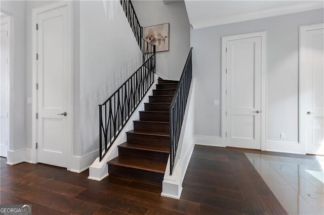 staircase featuring wood-type flooring