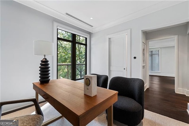 office area with dark hardwood / wood-style floors and ornamental molding