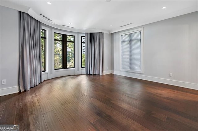 spare room featuring hardwood / wood-style floors