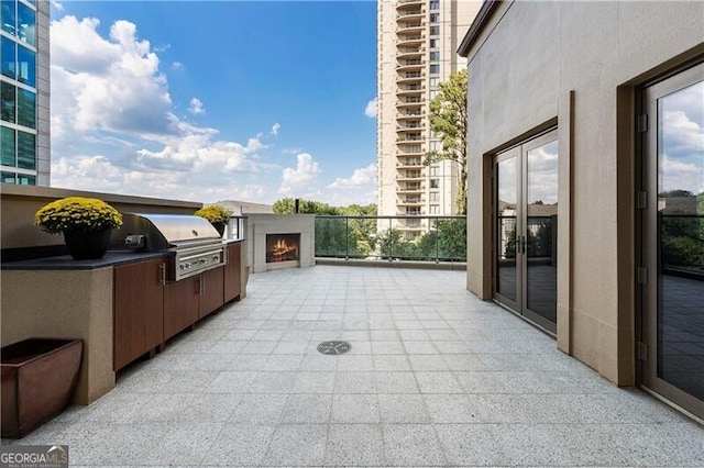 view of patio featuring grilling area, area for grilling, and a balcony