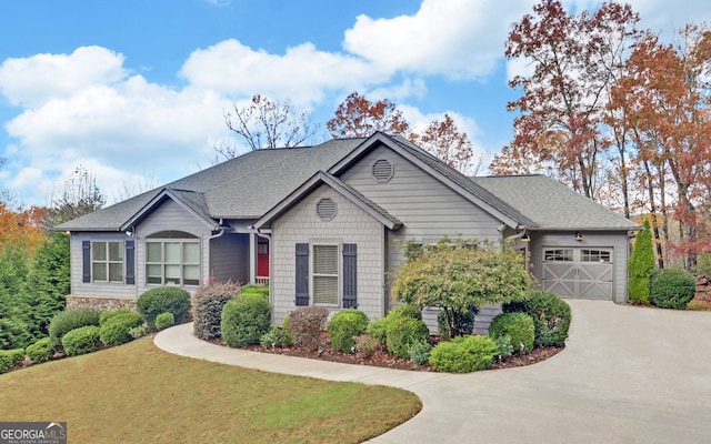 view of front facade featuring a garage and a front lawn