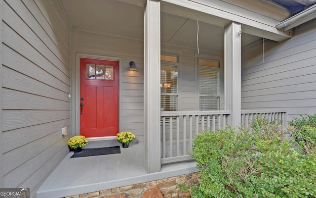 view of exterior entry with covered porch