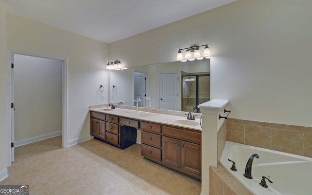 bathroom featuring plus walk in shower, tile patterned flooring, and vanity