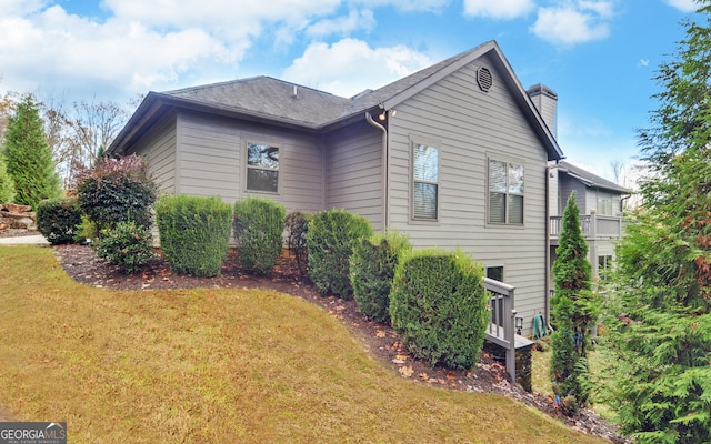 view of home's exterior featuring a yard