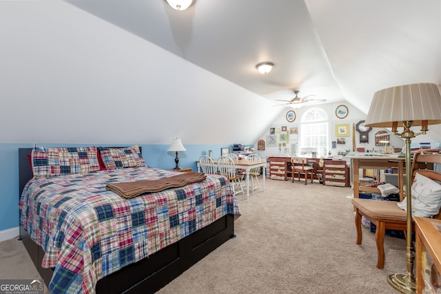 bedroom with ceiling fan, lofted ceiling, and carpet