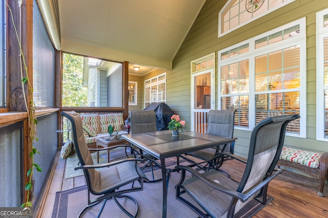 sunroom / solarium with vaulted ceiling