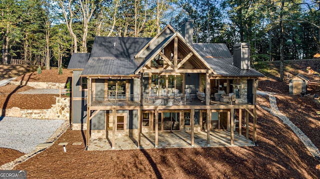 rear view of house featuring a patio area