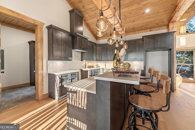 kitchen featuring light hardwood / wood-style flooring, wooden ceiling, lofted ceiling, and decorative light fixtures