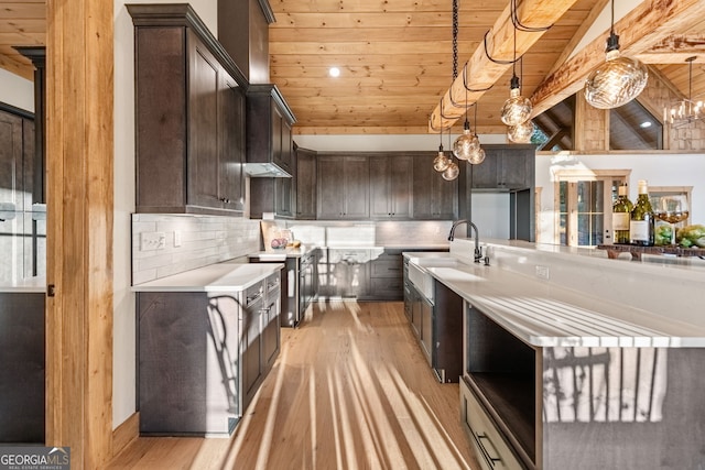 kitchen with dark brown cabinetry, decorative light fixtures, and wooden ceiling