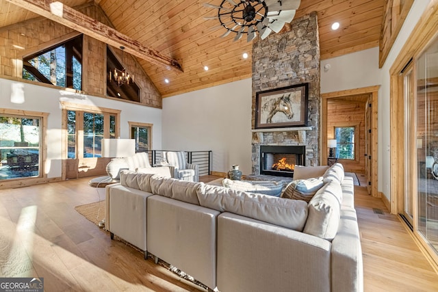 living room with high vaulted ceiling, wooden ceiling, and light hardwood / wood-style flooring