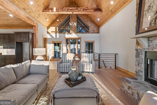 living room featuring a stone fireplace, light hardwood / wood-style floors, wooden ceiling, beam ceiling, and high vaulted ceiling