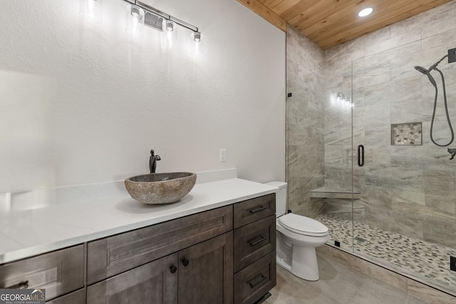 bathroom with vanity, a shower with shower door, toilet, and wooden ceiling