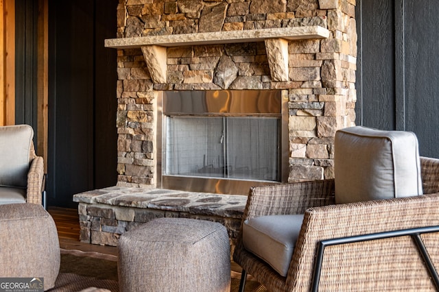 living area featuring a fireplace and wood-type flooring