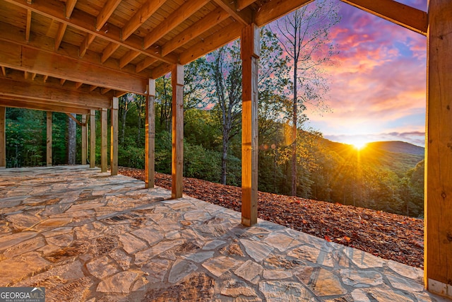 patio terrace at dusk with a mountain view