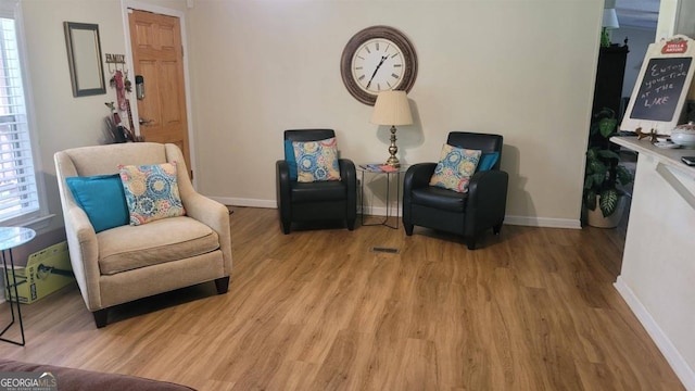 sitting room featuring light wood-type flooring