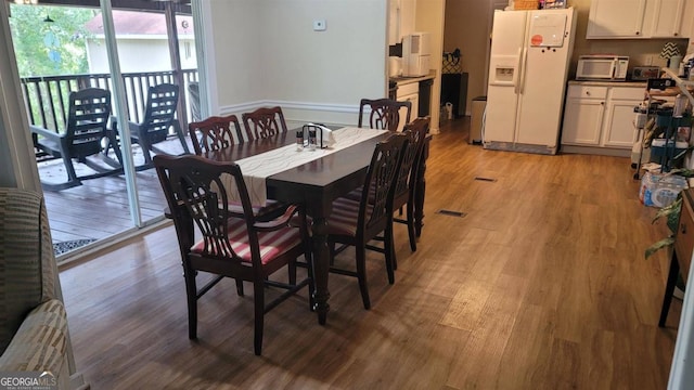 dining room with light hardwood / wood-style flooring