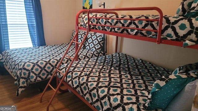 bedroom with hardwood / wood-style flooring