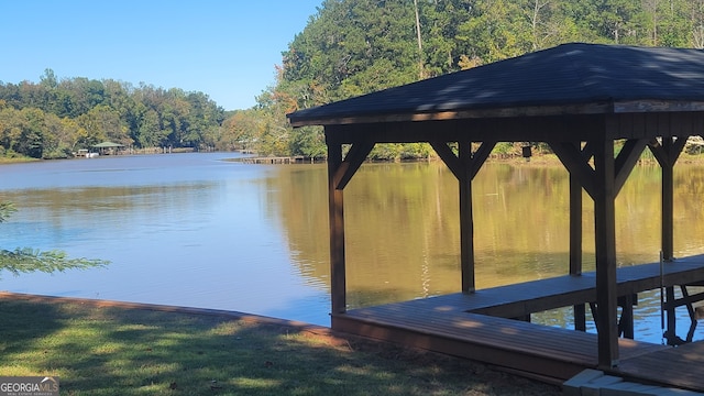 dock area with a gazebo and a water view