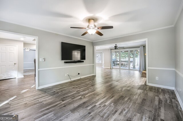 unfurnished living room with crown molding, ceiling fan, and dark hardwood / wood-style flooring