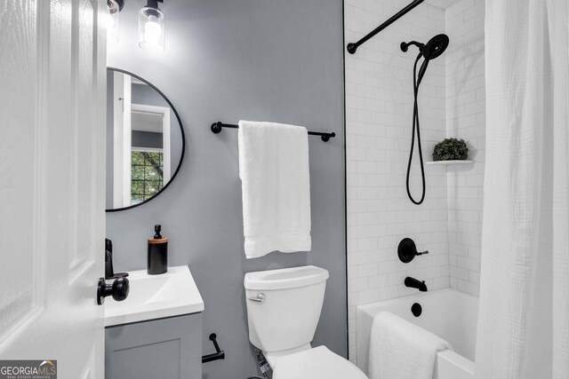 full bathroom featuring vanity, toilet, and shower / bath combo with shower curtain