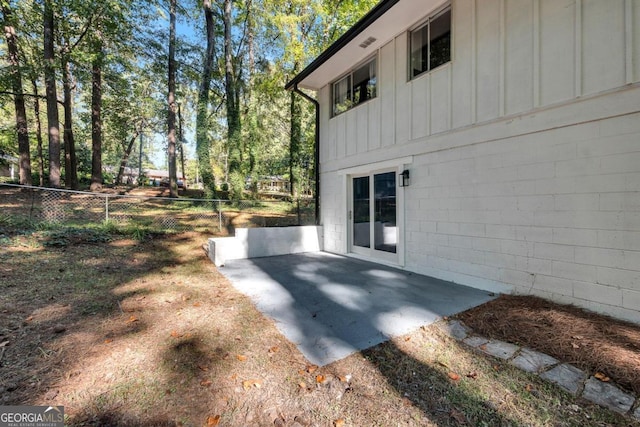 view of side of home featuring a patio