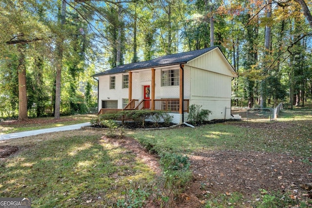 raised ranch featuring a front lawn