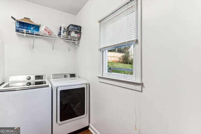 clothes washing area featuring washing machine and clothes dryer