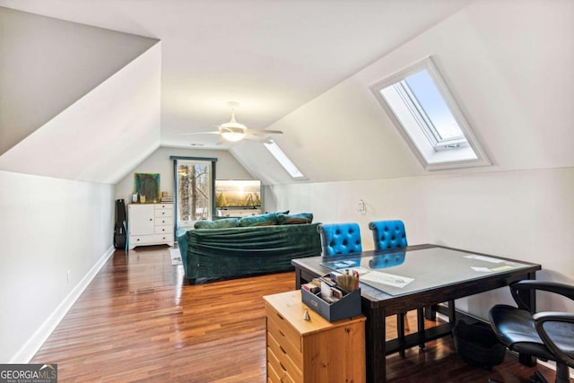 home office featuring a wealth of natural light, hardwood / wood-style floors, vaulted ceiling, and ceiling fan