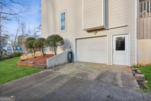 view of side of property with a garage